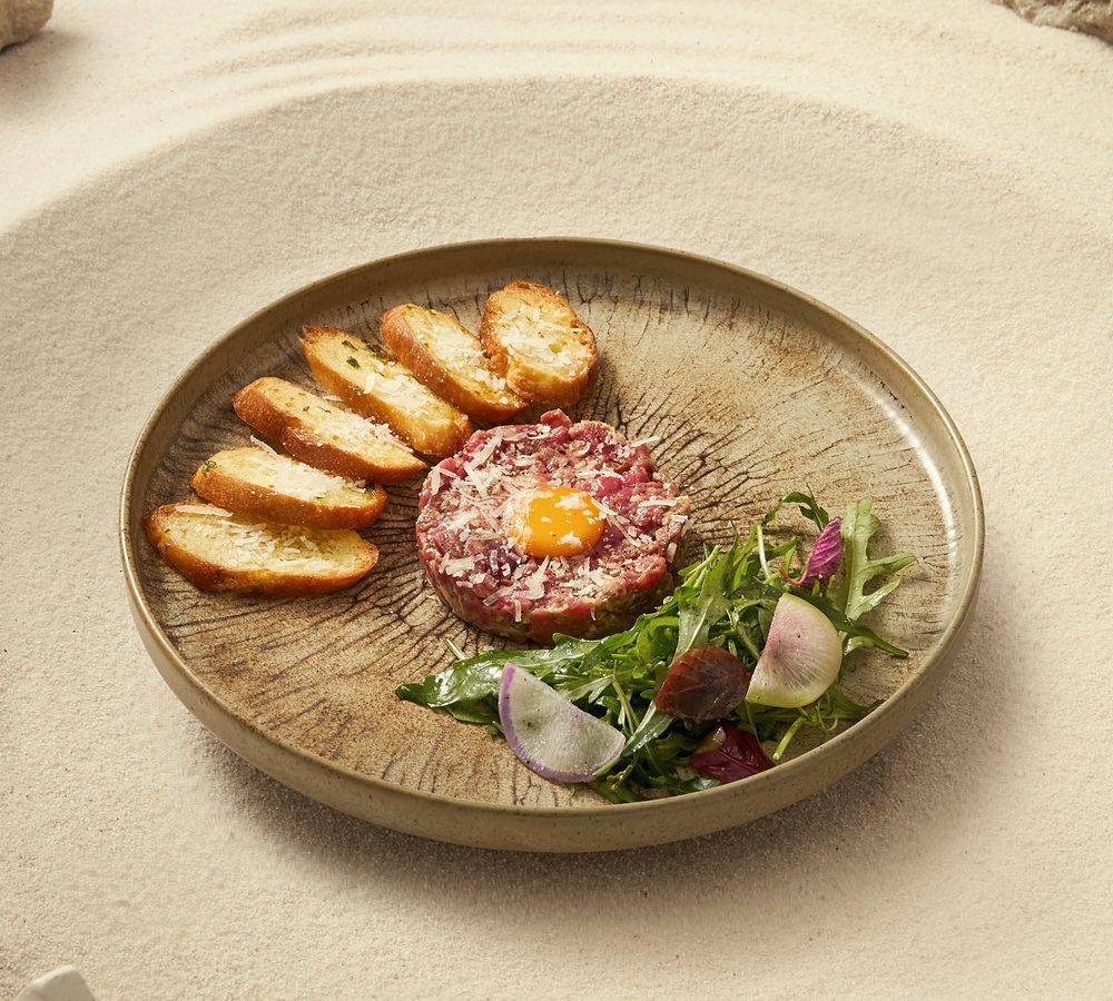 Beef tartare with egg yolk and toasts